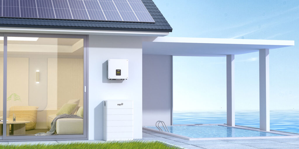 A modern home with solar panels, a Fox ESS inverter and a Fox ESS battery on the wall